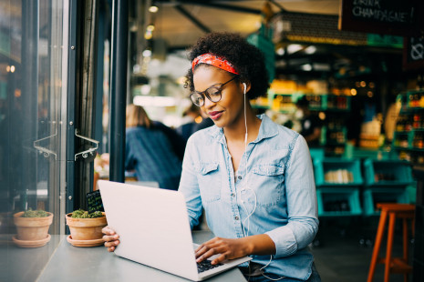 Young woman sitting at laptop